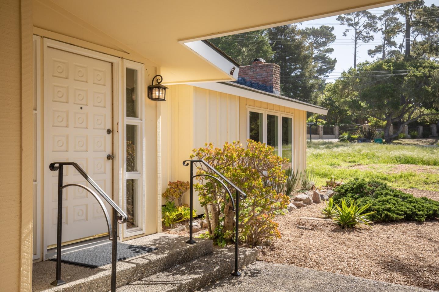1043 Ocean Road Pebble Beach, CA 93953 - Photo 2 of 18 a view of a house with backyard and sitting area