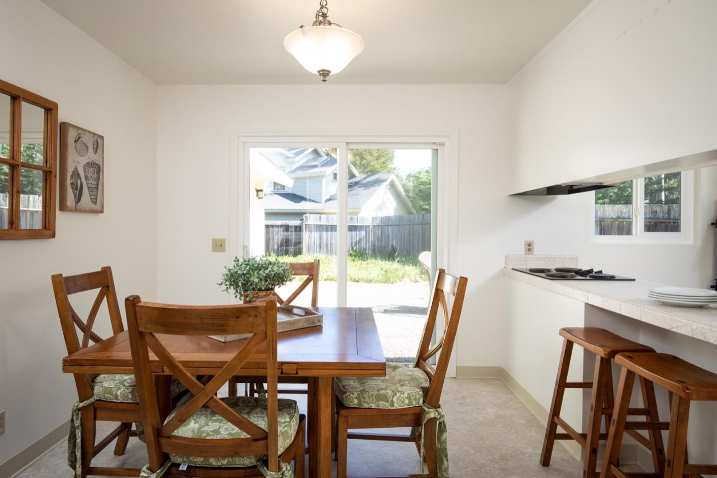 1043 Ocean Road Pebble Beach, CA 93953 - Photo 5 of 18 a view of a dining room with furniture window and outside view
