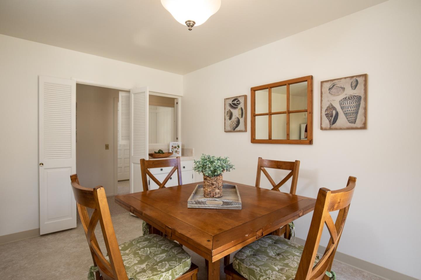 1043 Ocean Road Pebble Beach, CA 93953 - Photo 7 of 18 a view of a dining room with furniture