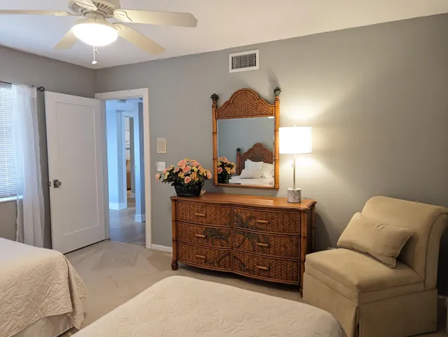 a bed room with a bed and a chandelier