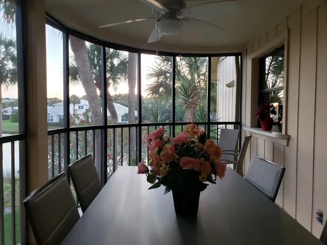 a view of a balcony filled with furniture