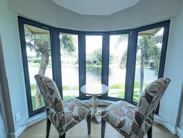 a view of a dining room with furniture window and outside view