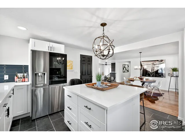 a kitchen that has a lot of cabinets and refrigerator