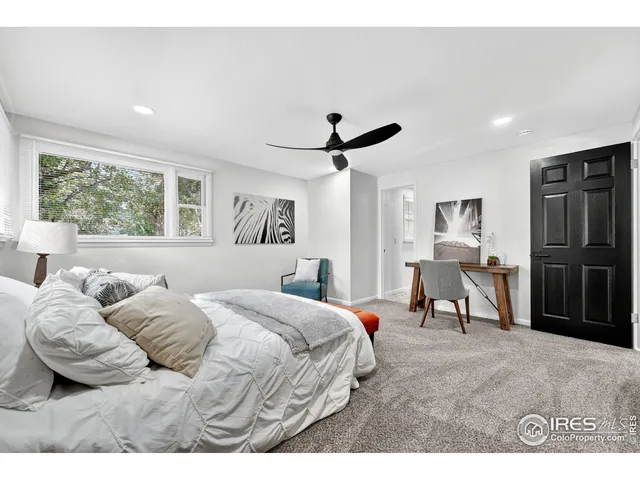 a bedroom with furniture and a window