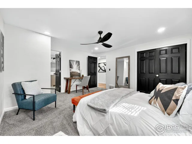 a bedroom with a bed and a chair