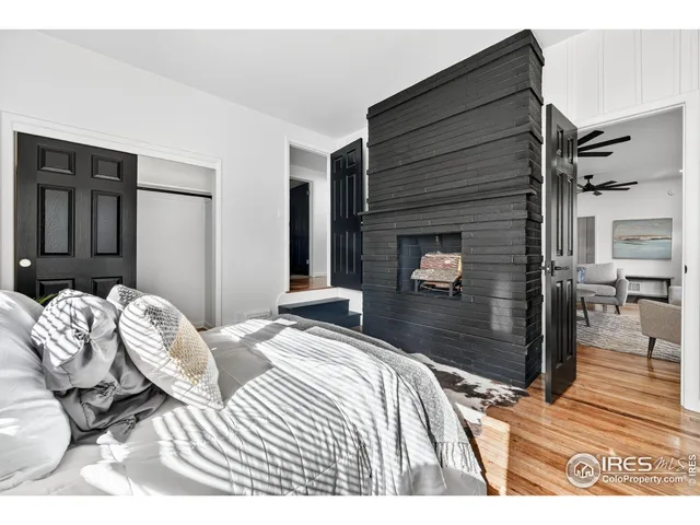 a bedroom with a bed and a couch