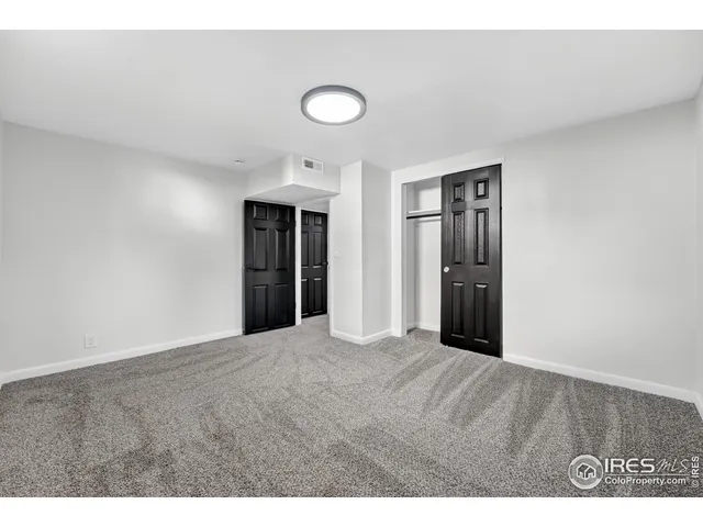 a bathroom with a toilet sink a mirror and shower
