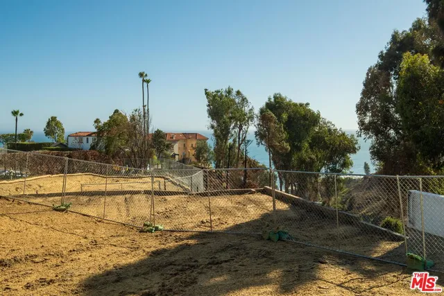 a view of a swimming pool with a yard
