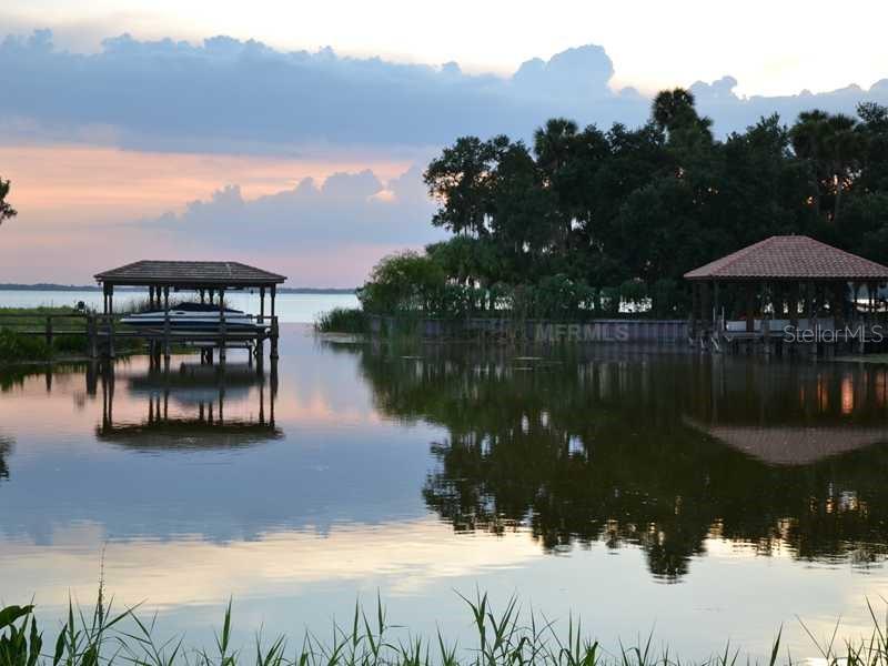 Sawgrass Run Tavares, FL 32778 - Photo 11 of 18 a swimming pool view with a lake view