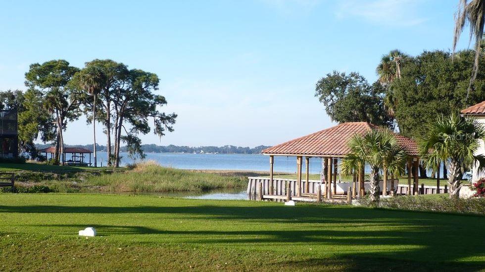Sawgrass Run Tavares, FL 32778 - Photo 13 of 18 a front view of a house with a garden