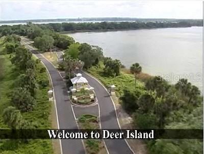 Sawgrass Run Tavares, FL 32778 - Photo 14 of 18 an aerial view of a residential houses with outdoor space and ocean view
