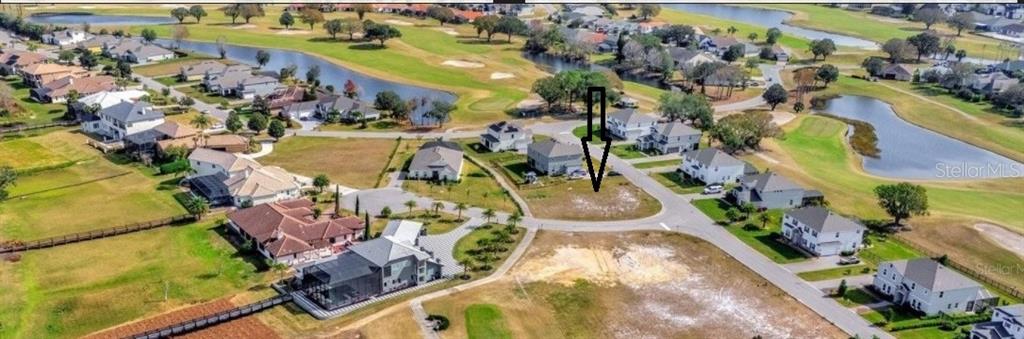 Sawgrass Run Tavares, FL 32778 - Photo 5 of 18 an aerial view of a house with a swimming pool