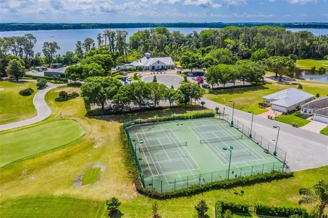 a view of a swimming pool with a yard