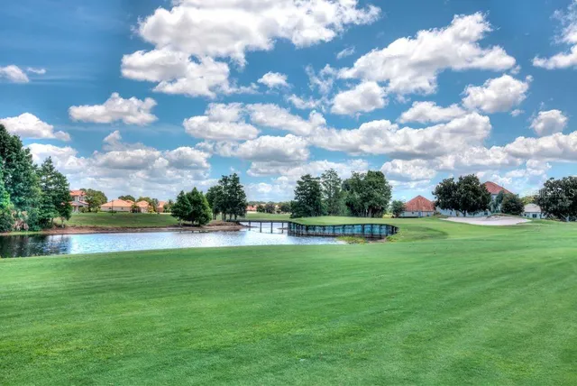 a view of a golf course with a lake