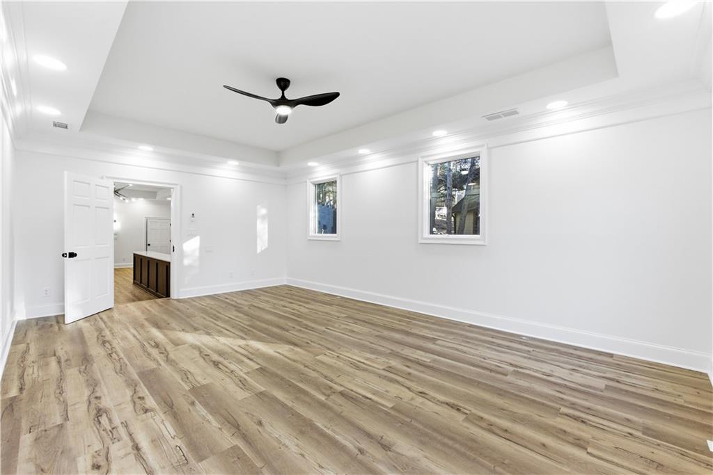 2390 Peachtree Road Cumming, GA 30041 - Photo 60 of 82 a view of a livingroom with a ceiling fan and wooden floor