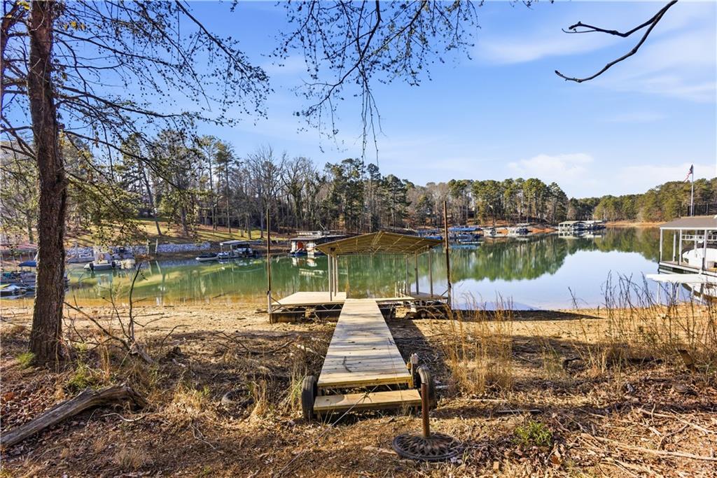2390 Peachtree Road Cumming, GA 30041 - Photo 78 of 82 a view of a lake with houses in the back