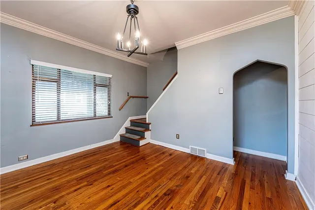 a kitchen with a sink a stove a refrigerator and cabinets
