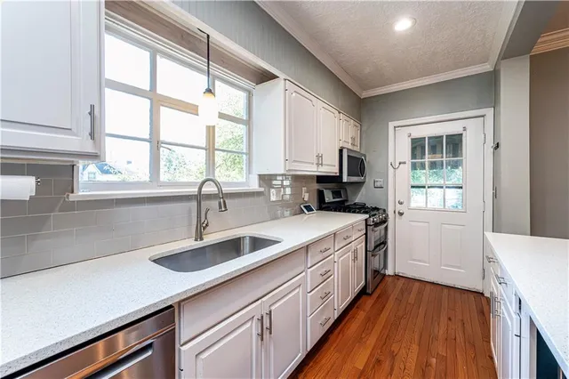 a bathroom with a toilet and a sink