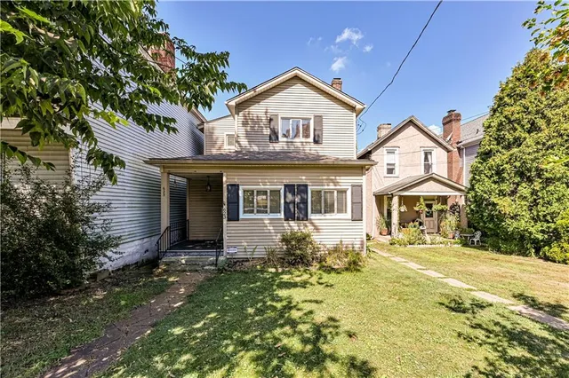 a backyard of a house with lots of green space