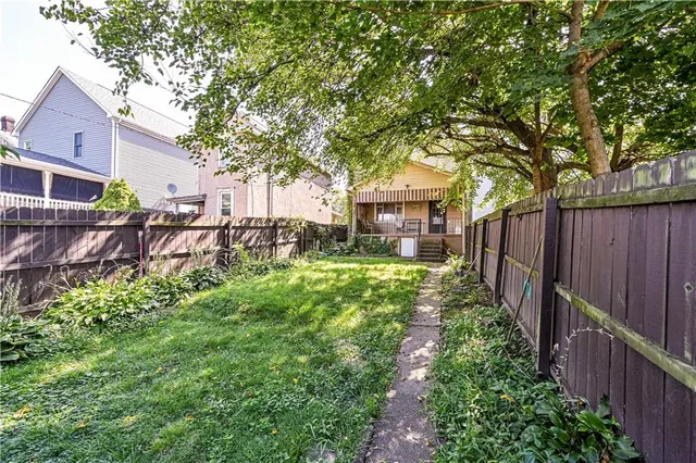 a backyard of a house with lots of green space