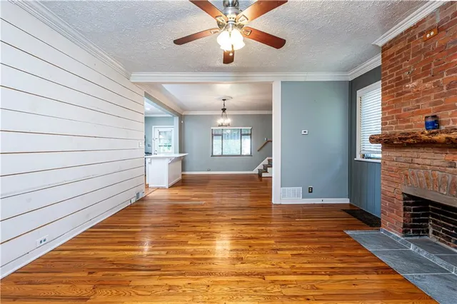 a view of livingroom with hardwood floor and ceiling fan