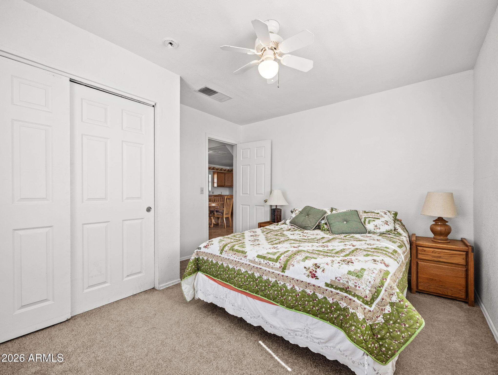 18420 Peeples Valley Road Peeples Valley, AZ 86332 - Photo 18 of 31 a bedroom with a bed and a chandelier