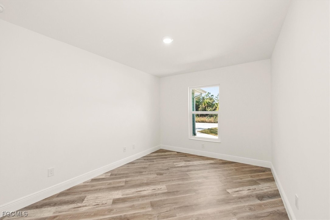 802 North Avenue Lehigh Acres, FL 33972 - Photo 24 of 39 an empty room with a window
