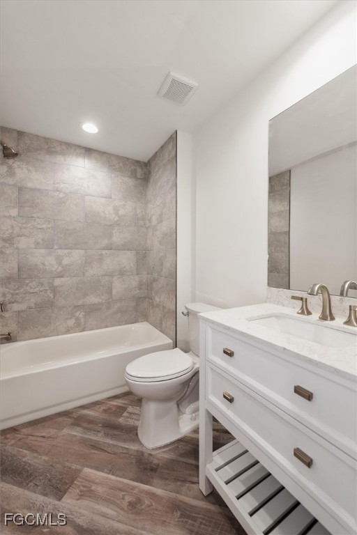 802 North Avenue Lehigh Acres, FL 33972 - Photo 28 of 39 a bathroom with a sink a toilet and a bathtub