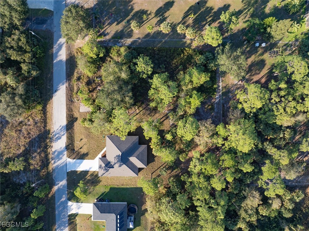 802 North Avenue Lehigh Acres, FL 33972 - Photo 38 of 39 an aerial view of a house with a yard and garden