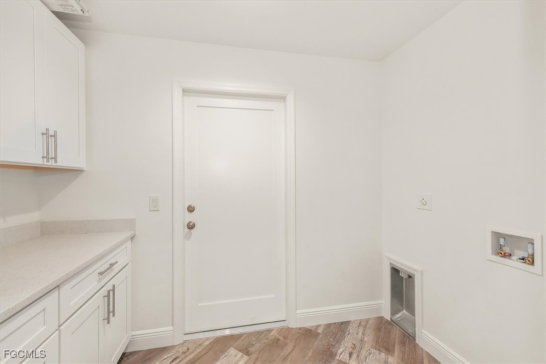 802 North Avenue Lehigh Acres, FL 33972 - Photo 9 of 39 a bathroom with a sink and vanity