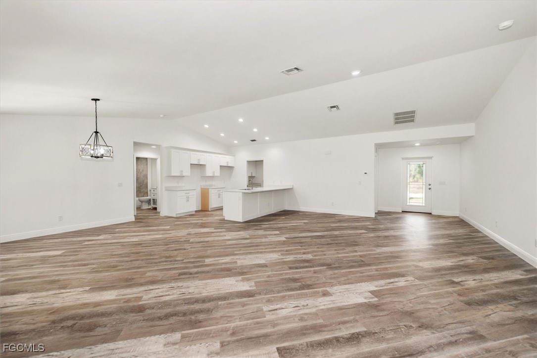 802 North Avenue Lehigh Acres, FL 33972 - Photo 10 of 39 a view of empty room with wooden floor