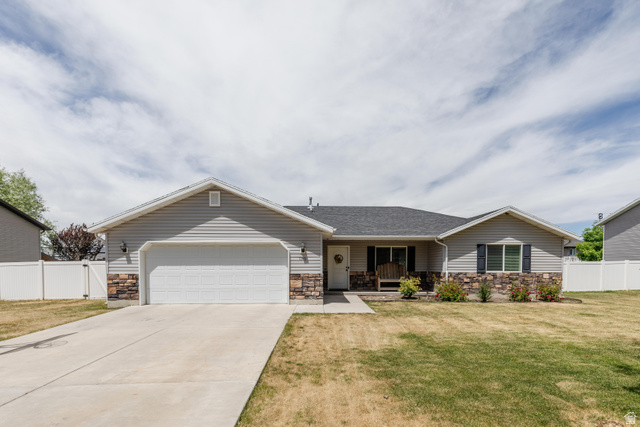 1145 West 2640th Street South Logan, UT 84321 - Photo 2 of 17 Ranch-style residence featuring light gray siding and a dark shingle roof