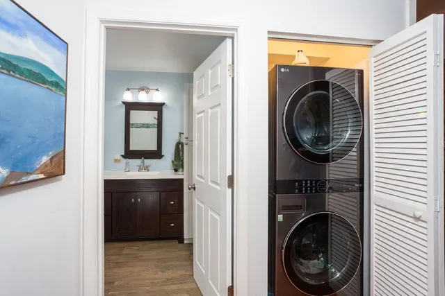 a view of a hallway with washer and dryer