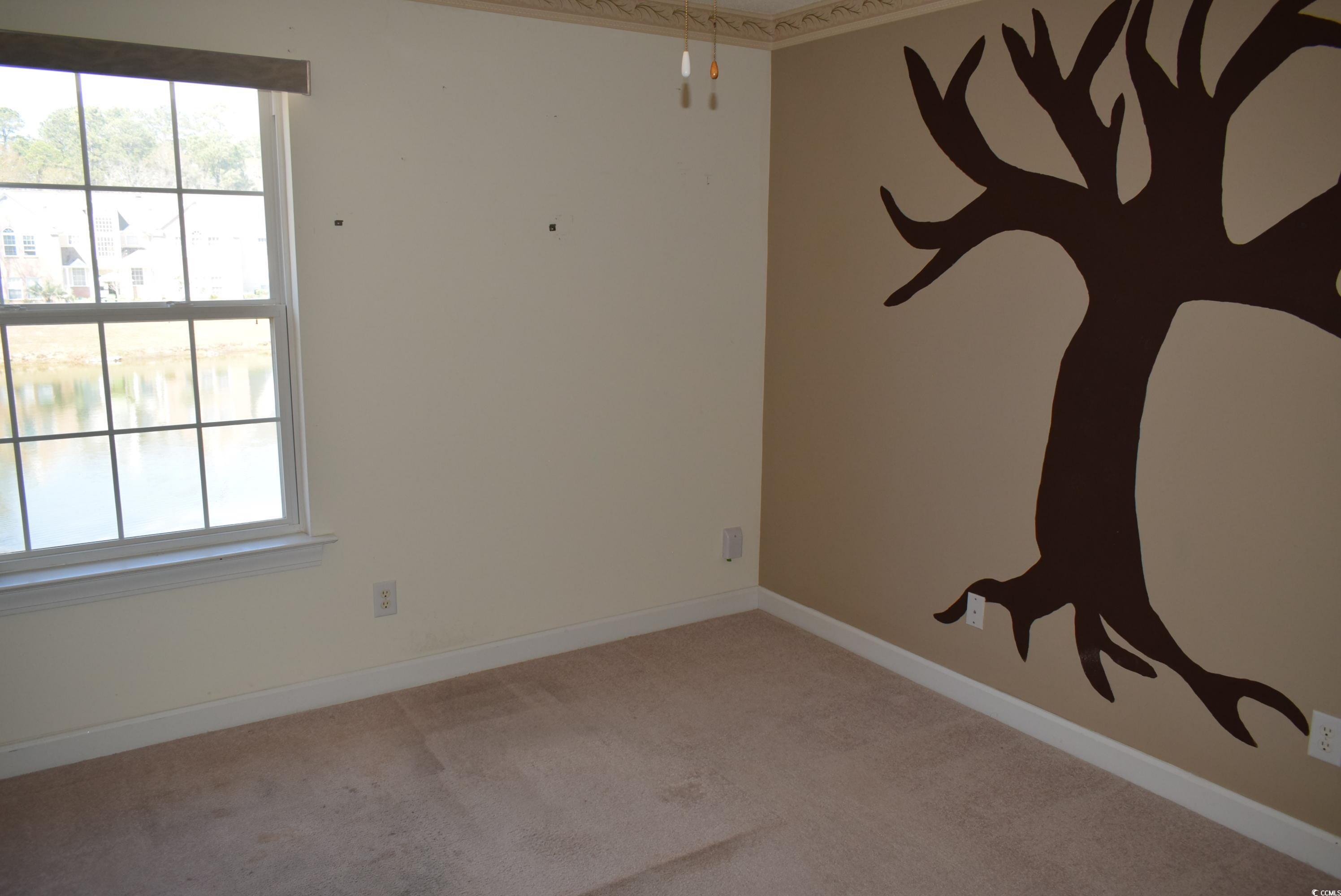 4300 Lotus Court, Unit G Murrells Inlet, SC 29576 - Photo 12 of 27 Unfurnished room featuring carpet flooring and baseboards