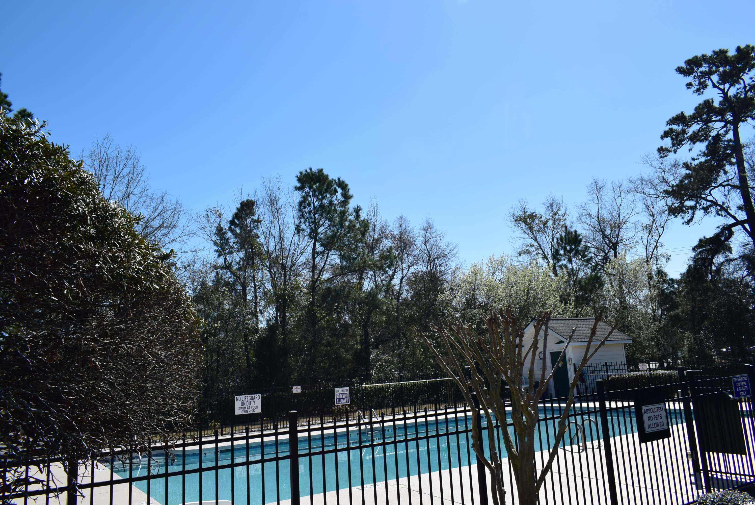 4300 Lotus Court, Unit G Murrells Inlet, SC 29576 - Photo 25 of 27 Community pool with fence