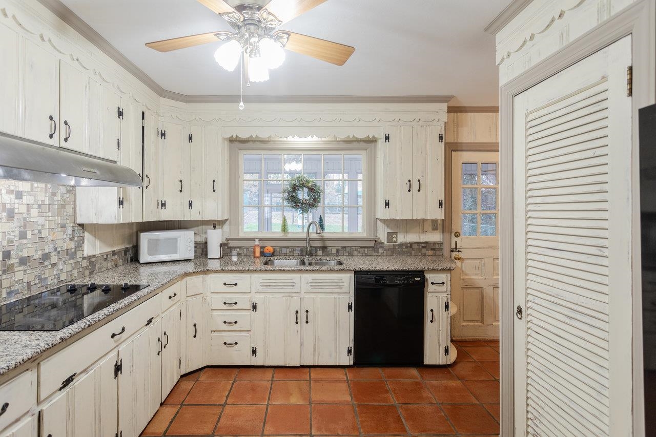 321 Franklin Street Harrisonburg, VA 22801 - Photo 16 of 54 a large kitchen with stainless steel appliances granite countertop a sink and cabinets