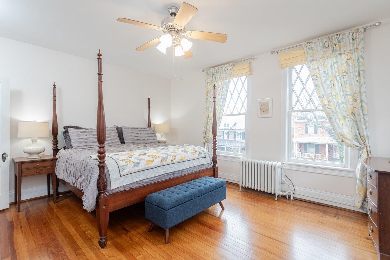 321 Franklin Street Harrisonburg, VA 22801 - Photo 25 of 54 a bedroom with a bed chandelier and a window
