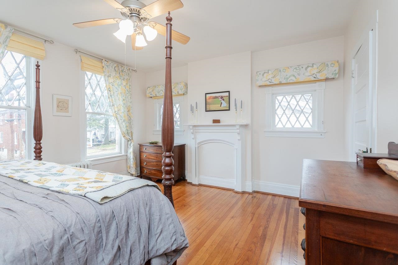 321 Franklin Street Harrisonburg, VA 22801 - Photo 26 of 54 a bedroom with a bed and a table in it with window