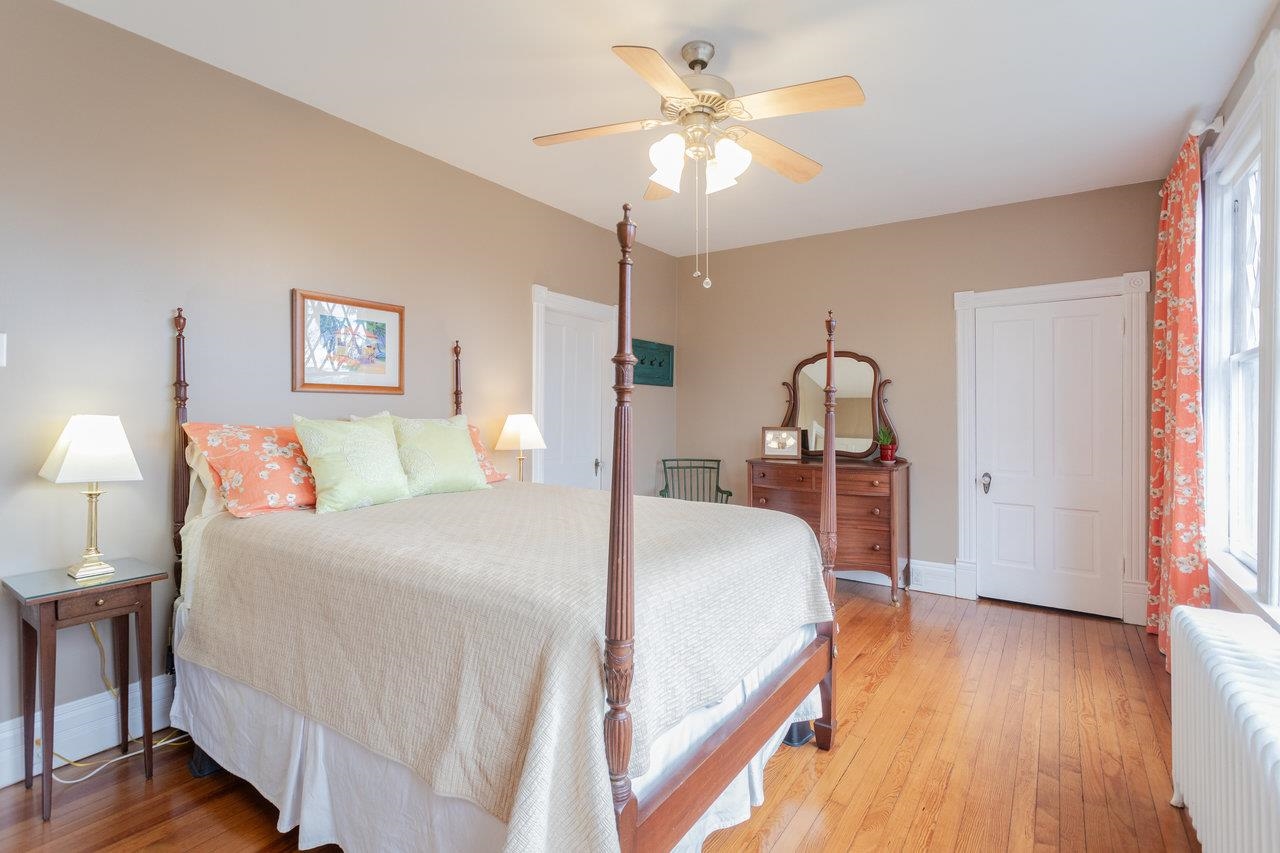 321 Franklin Street Harrisonburg, VA 22801 - Photo 28 of 54 a bed room with a bed and a chandelier