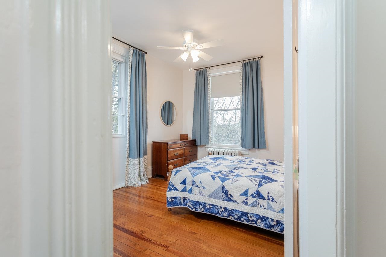 321 Franklin Street Harrisonburg, VA 22801 - Photo 34 of 54 a bedroom with a bed and window with chair