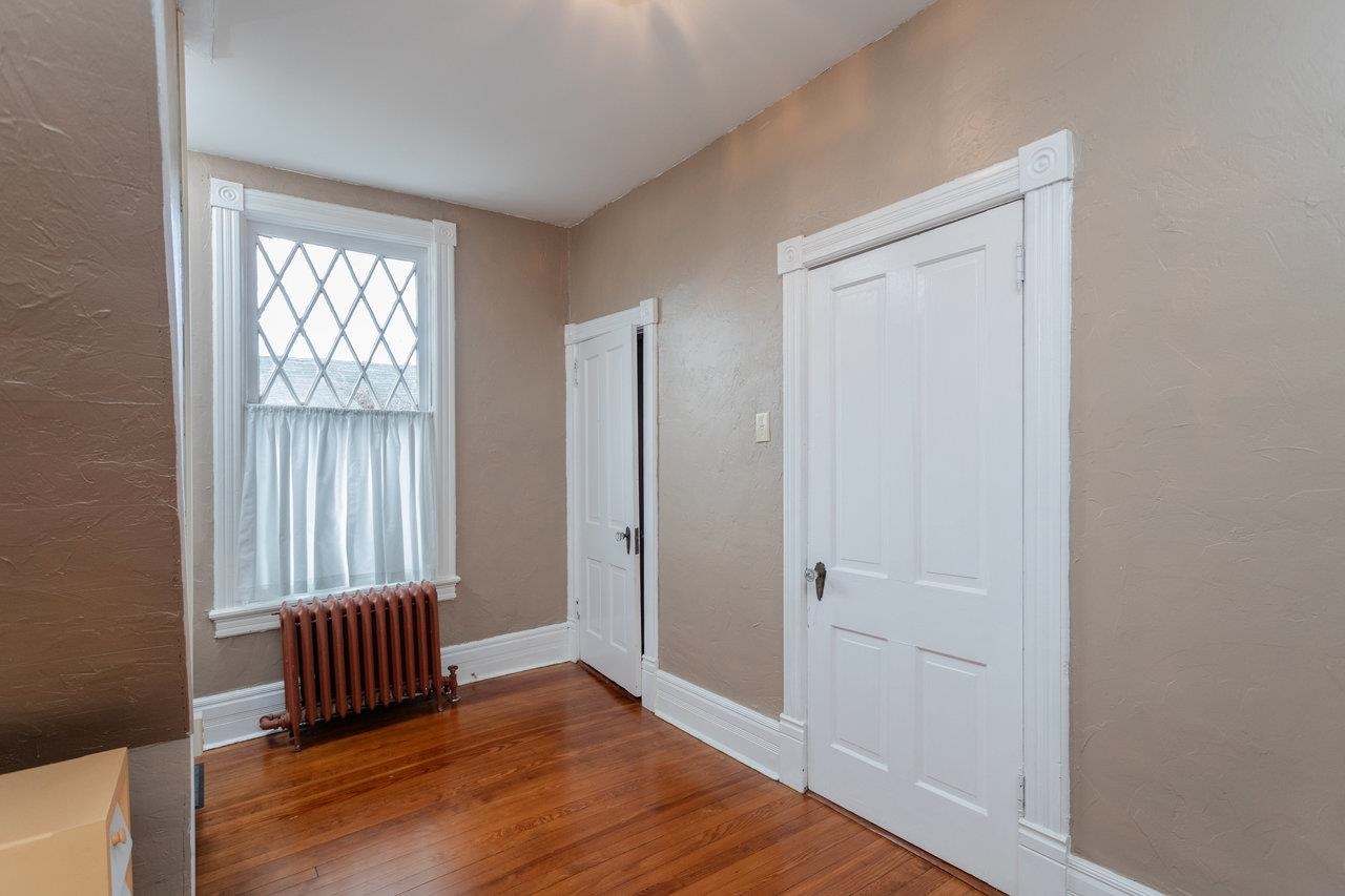 321 Franklin Street Harrisonburg, VA 22801 - Photo 37 of 54 an empty room with wooden floor and windows