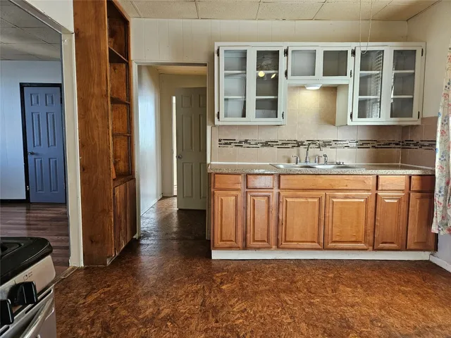 a view of a kitchen with granite countertop a sink