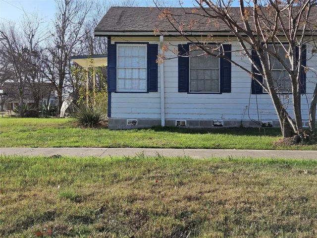 a view of a closet with wooden floor