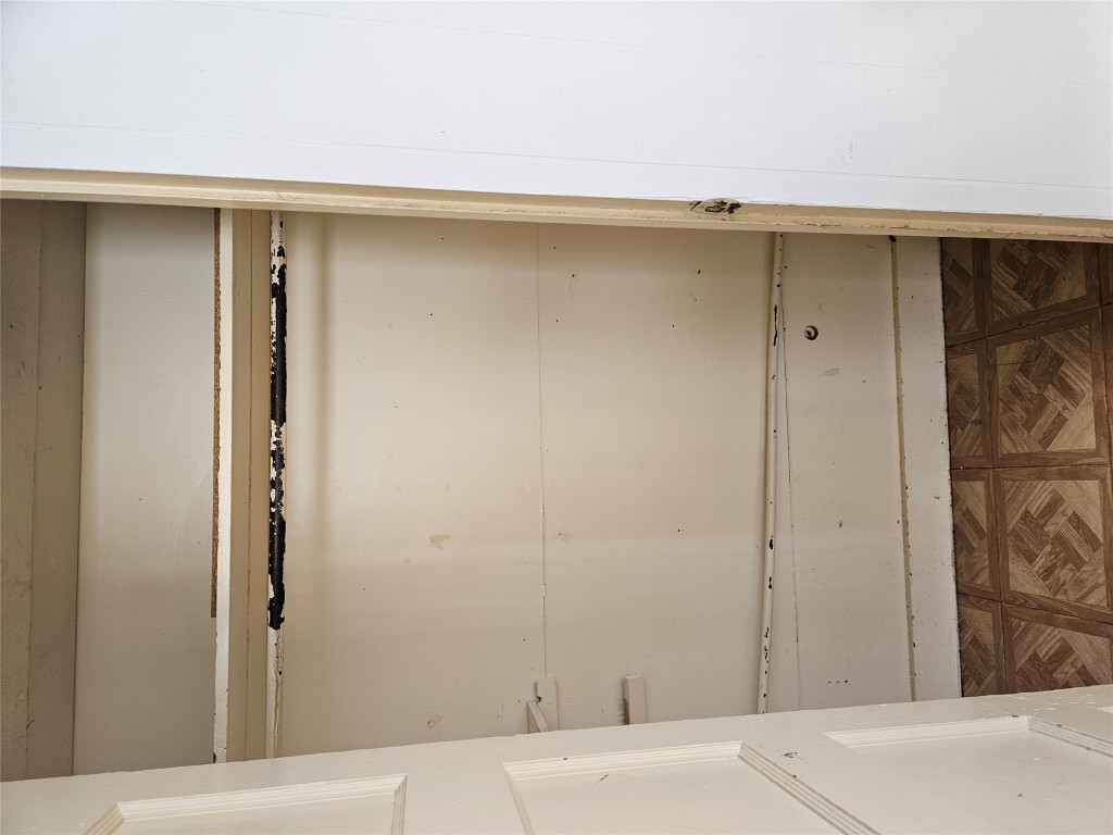 501 Burnet Street Manor, TX 78653 - Photo 18 of 22 a view of a closet with wooden floor