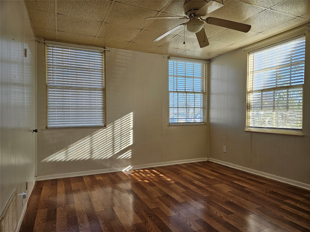 501 Burnet Street Manor, TX 78653 - Photo 22 of 22 a view of empty room with wooden floor and fan