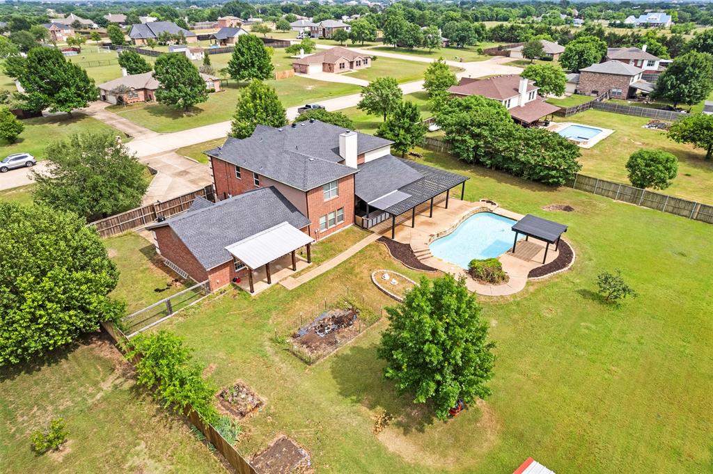 3931 Alpha Way Midlothian, TX 76065 - Photo 4 of 33 an aerial view of residential houses with outdoor space and swimming pool