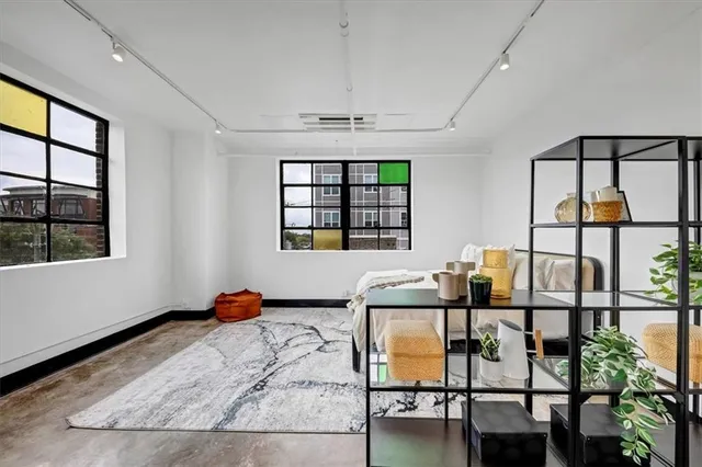 a bedroom with furniture and window