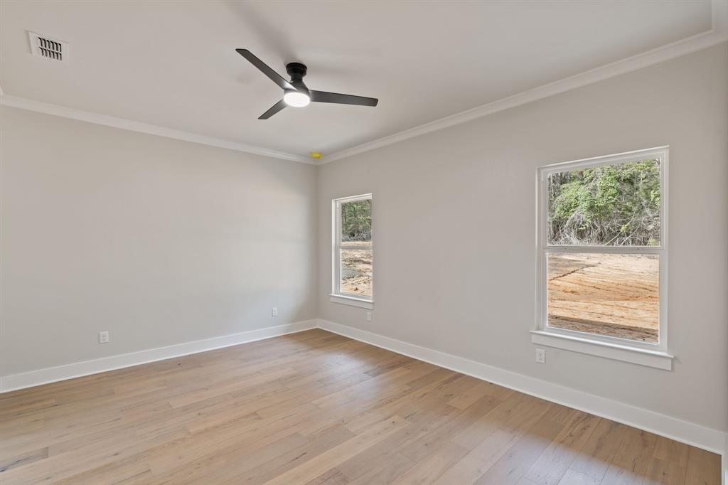 335 Perdanales Bullard, TX 75757 - Photo 22 of 37 a view of an empty room with wooden floor and a window