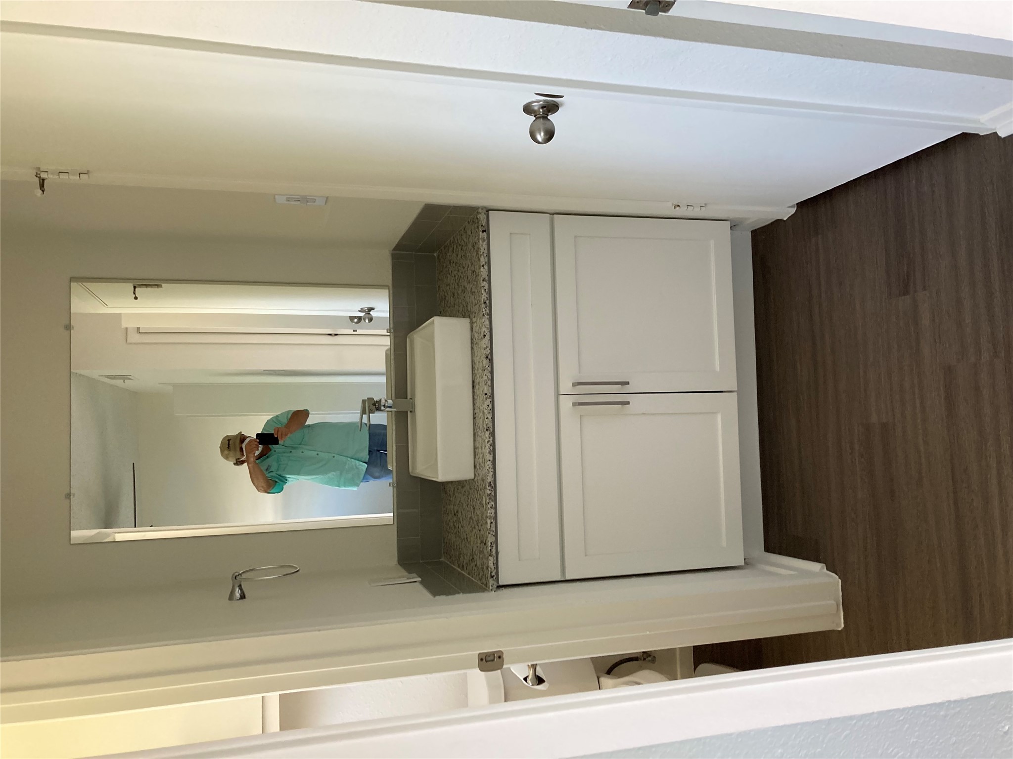 2627 Jones Road Austin, TX 78745 - Photo 4 of 4 Bathroom featuring vanity and dark wood-type flooring