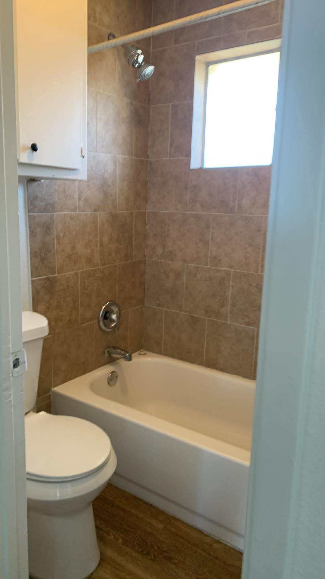 2627 Jones Road Austin, TX 78745 - Photo 4 of 8 Full bath with bathing tub / shower combination and dark wood-style floors